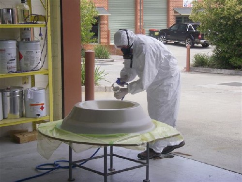 Lachlan from EMP spraying the gellcoat on the rim mould