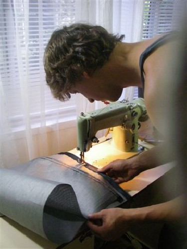 Clark sewing hem onto test fabric for PAC2