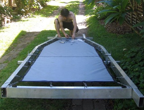 Chris hooking on the material skin that the tent will sit ontop of on the PAC.