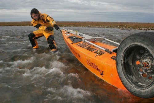 Chris dragging PAC up rapids.