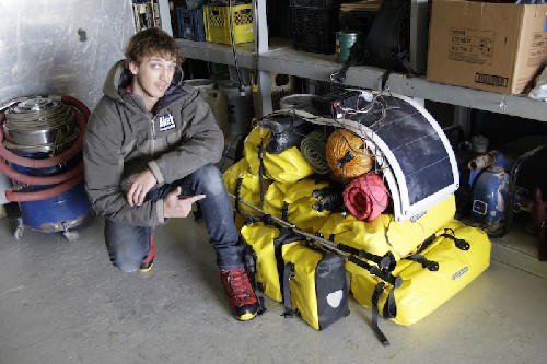 Clark infront of his pile of gear - all 200kgs of it - all you need to survive the arctic for 100 days