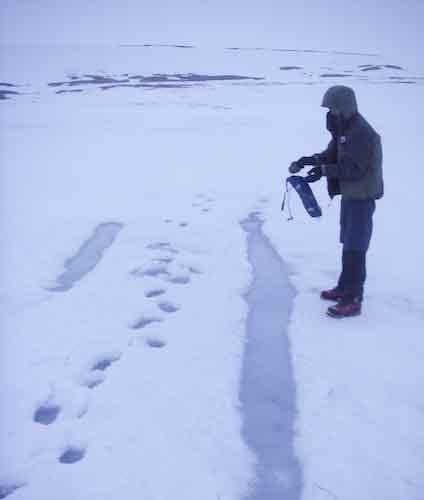 Filling up our camelbaks with water from the PAC\'s path through the sloppy snow