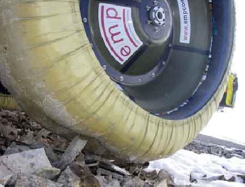 Death terrain trying to stab our Kevlar tire covering - note food packets stuffed in rim edge