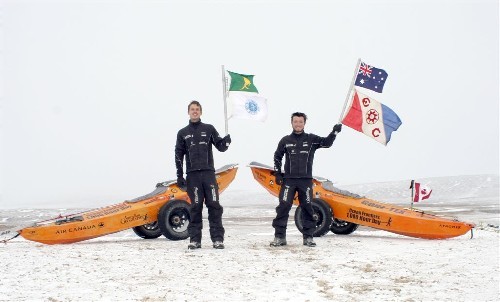 Ceremonial flag waving before being picked up at the end of 2005 expedition