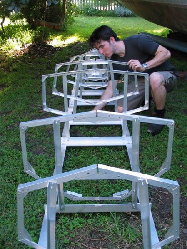 Chris assembling PAC frames to form skeleton to wrap aluminium sheeting over