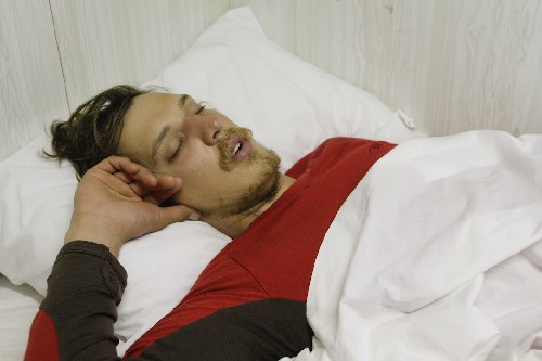Clark dead to the world - first sleep in a real bed on the tug the Jock McNiven