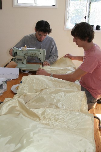 Chris and Clark sewing Kevlar cover for PAC tyres
